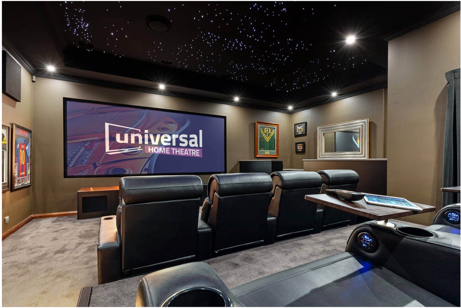 Dedicated cinema room installed by Universal Home Theatre — starlight ceiling, large-format screen and theatre recliners